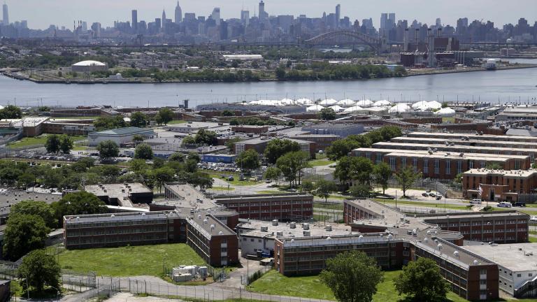 In a June 20, 2014, file photo, the Rikers Island jail complex stands in New York with the Manhattan skyline in the background. (AP Photo / Seth Wenig, File) In a June 20, 2014, file photo, the Rikers Island jail complex stands in New York with the Manhattan skyline in the background. (AP Photo / Seth Wenig, File)
