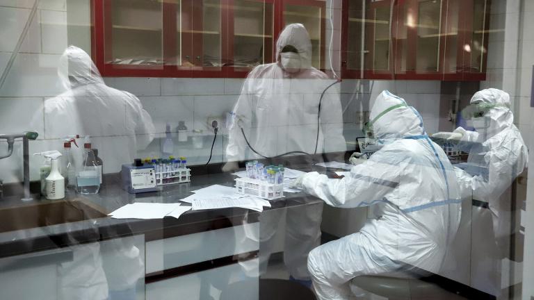 In this Tuesday, March, 10, 2020 photo, paramedics test samples taken from patients suspected of being infected with the new coronavirus, at a laboratory in the southwestern city of Ahvaz, Iran. (Amin Nazari / ISNA via AP)