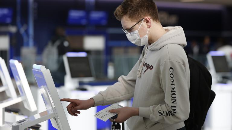 New York University student Hector Medrano, of Los Angeles, checks in for his flight using a touchscreen Saturday, March 14, 2020, at jetBlue's terminal in John F. Kennedy International Airport in New York. (AP Photo / Kathy Willens) New York University student Hector Medrano, of Los Angeles, checks in for his flight using a touchscreen Saturday, March 14, 2020, at jetBlue's terminal in John F. Kennedy International Airport in New York. (AP Photo / Kathy Willens)
