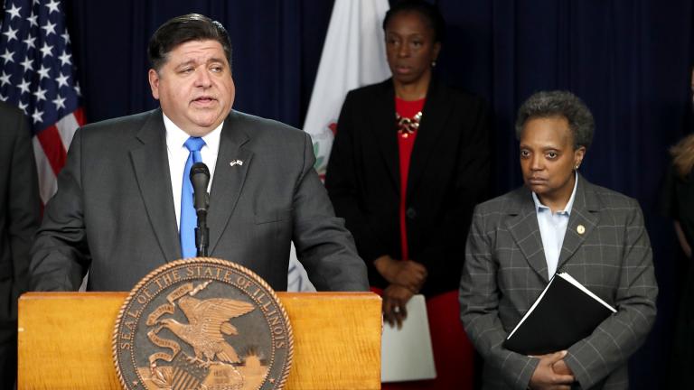 Illinois Gov. J.B. Pritzker, left, announces a shelter-in-place order to combat the spread of COVID-19, as Chicago Mayor Lori Lightfoot, right, listens, during a news conference Friday, March 20, 2020, in Chicago. (AP Photo / Charles Rex Arbogast)