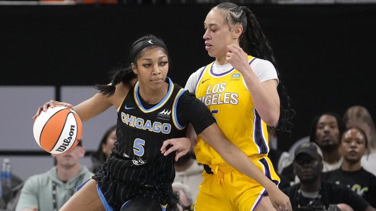 Chicago Sky's Angel Reese (5) drives to the basket as Los Angeles Sparks' Dearica Hamby defends during the first half of a WNBA basketball game Thursday, May 30, 2024, in Chicago. (AP Photo/Charles Rex Arbogast)