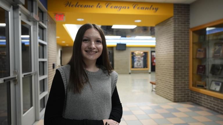 Makenzie Gilkison stands in the main lobby at Greenfield Central High School, Tuesday, Dec. 17, 2024, in Greenfield, Ind. (AP Photo/Darron Cummings)