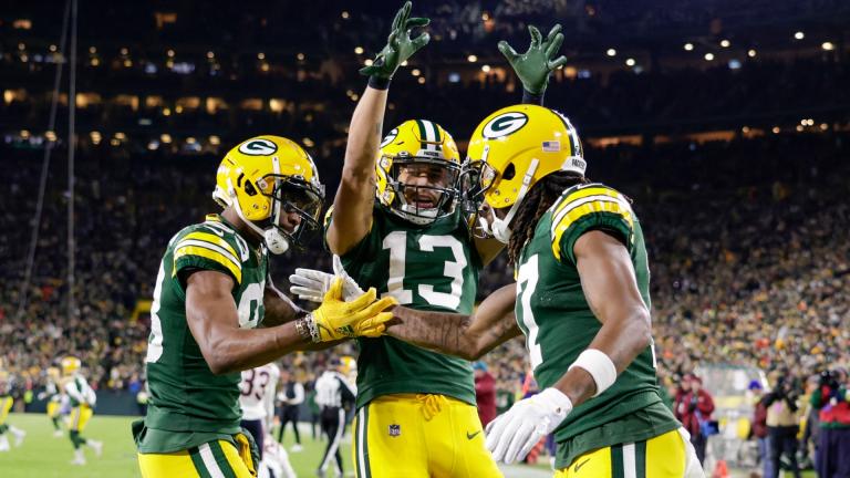Green Bay Packers’ Davante Adams celebrates his touchdown catch with Marquez Valdes-Scantling and Allen Lazard (13) during the first half of an NFL football game against the Chicago Bears Sunday, Dec. 12, 2021, in Green Bay, Wis. (AP Photo / Matt Ludtke)