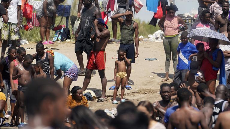 Haitian migrants gather on the banks of the Rio Grande after they crossed into the United States from Mexico, Saturday, Sept. 18, 2021, in Del Rio, Texas. (AP Photo / Eric Gay)