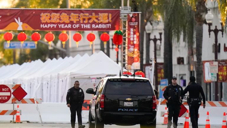 Police officers stand outside a ballroom dance club in Monterey Park, Calif., Sunday, Jan. 22, 2023. (AP Photo / Jae C. Hong)