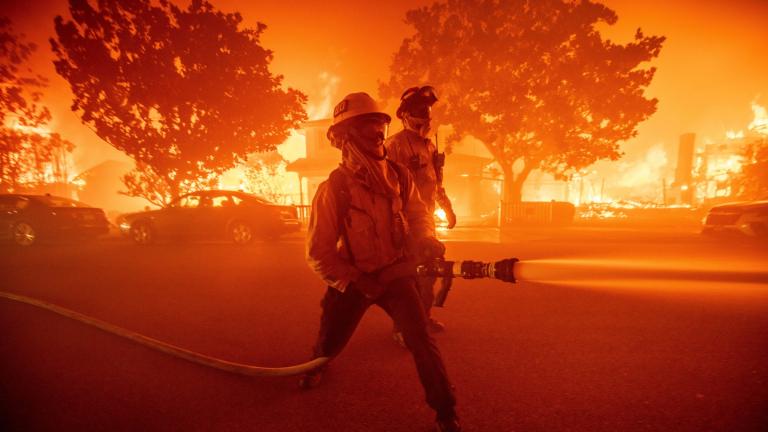 Firefighters battle the Palisades Fire as it burns multiple structures in the Pacific Palisades neighborhood of Los Angeles, Tuesday, Jan. 7, 2025. (Ethan Swope / AP Photo)