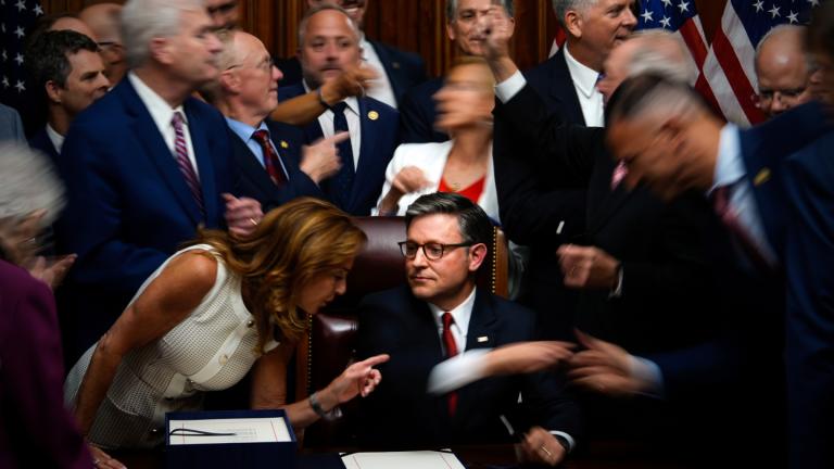Republican members of Congress reach to shake hands with Speaker of the House Mike Johnson, R-La., center bottom, after Johnson signed President Donald Trump’s signature bill of tax breaks and spending cuts, Thursday, July 3, 2025, at the Capitol in Washington. (AP Photo / Julia Demaree Nikhinson)
