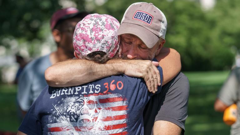 Activist and entertainer Jon Stewart hugs fellow advocate Susan Zeier of Sandusky, Ohio, just after Senate Majority Leader Chuck Schumer, D-N.Y., assured veterans and military family members that the Senate will vote on a bill designed to help millions of veterans exposed to toxic substances during their military service, at the Capitol in Washington, Tuesday, Aug. 2, 2022. (AP Photo / J. Scott Applewhite)