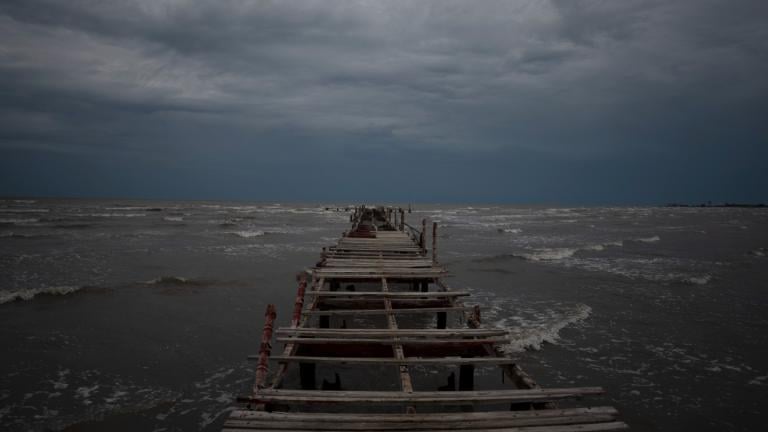 Waves kick up under a dark sky along the shore of Batabano, Cuba, Monday, Sept. 26, 2022. (AP Photo / Ramon Espinosa)