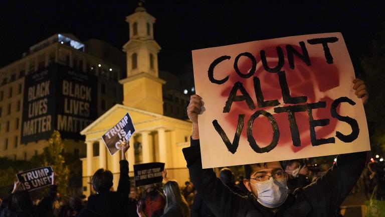 A demonstrator holds up a sign while waiting for election results at Black Lives Matter Plaza, Tuesday, Nov. 3, 2020, in Washington. (AP Photo / John Minchillo) A demonstrator holds up a sign while waiting for election results at Black Lives Matter Plaza, Tuesday, Nov. 3, 2020, in Washington. (AP Photo / John Minchillo)