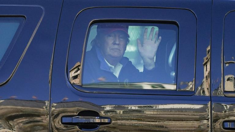 President Donald Trump waves to supporters from his motorcade as people gather for a march Saturday, Nov. 14, 2020, in Washington. (AP Photo / Julio Cortez)