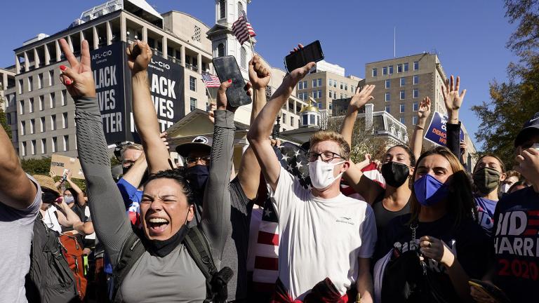 People gathered in Black Lives Matter Plaza react to the presidential race being called by CNN in Democratic presidential candidate Joe Biden’s favor over Pres. Donald Trump to become the 46th president of the United States, Saturday, Nov. 7, 2020, in Washington. (AP Photo / Alex Brandon)