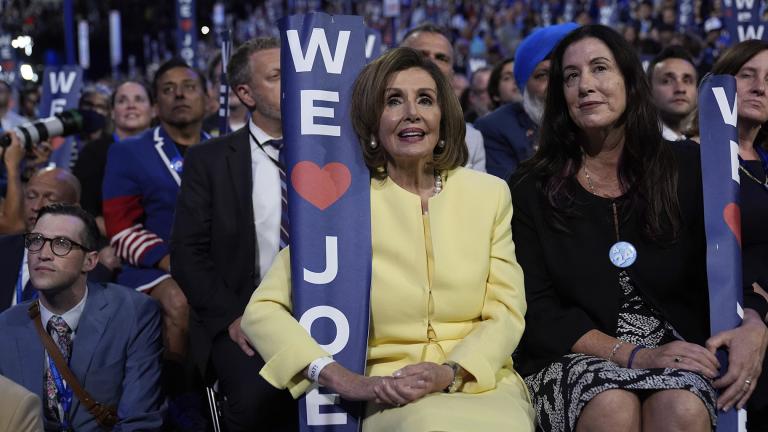 Rep. Nancy Pelosi, D-Calif., holds a sign as President Joe Biden speaks during the Democratic National Convention Monday, Aug. 19, 2024, in Chicago. (AP Photo / Paul Sancya)
