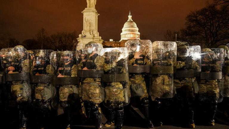 District of Columbia National Guard stand outside the Capitol, Wednesday night, Jan. 6, 2021, after a day of rioting protesters. (AP Photo / John Minchillo)