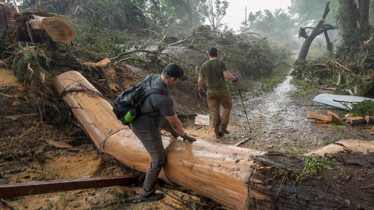 Volunteers search for missing people along the banks of the Guadalupe River after recent flooding on Sunday, July 6, 2025, in Hunt, Texas. (AP Photo / Rodolfo Gonzalez)