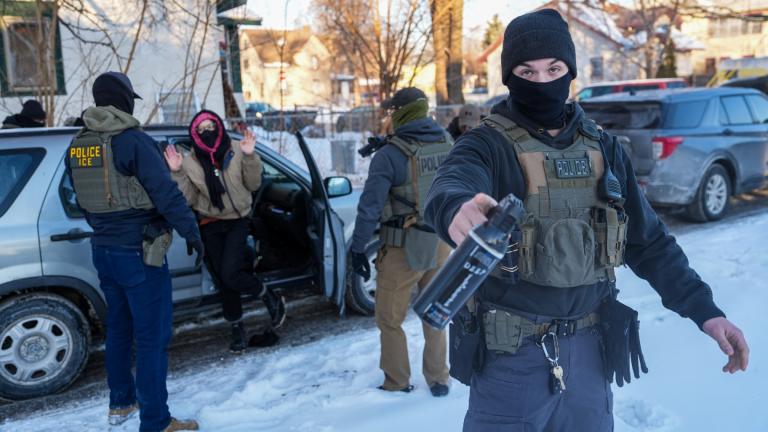 Activists are approached by federal agents for following agent vehicles, on Tuesday, Feb. 3, 2026, in Minneapolis. (AP Photo / Ryan Murphy)
