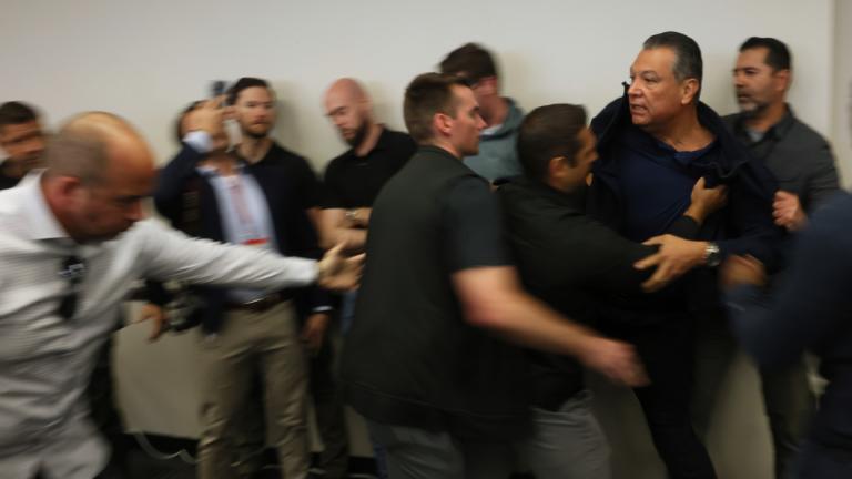 U.S. Sen. Alex Padilla, D-Calif., is pushed out of the room as Homeland Security Secretary Kristi Noem holds a news conference regarding the recent protests in Los Angeles on Thursday, June 12, 2025. (AP Photo / Etienne Laurent)