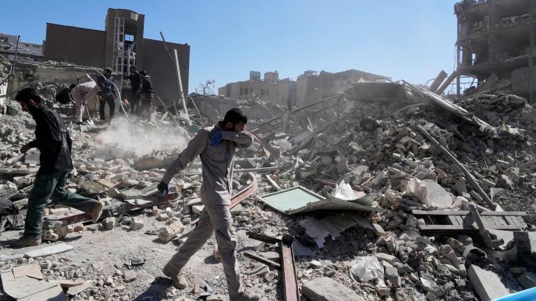 A group of men inspects the ruins of a police station struck Monday amid the U.S.–Israeli military campaign in Tehran, Iran, Tuesday, March 3, 2026. (AP Photo/Vahid Salemi)