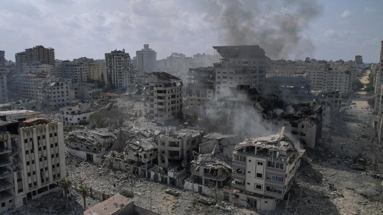 A view of the rubble of buildings hit by an Israeli airstrike, in Gaza City, Tuesday, Oct. 10, 2023. Israel has launched intense airstrikes in Gaza after the territory's militant rulers carried out an unprecedented attack on Israel Saturday, killing over 900 people and taking captives. Hundreds of Palestinians have been killed in the airstrikes. (AP Photo / Hatem Moussa)