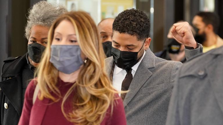 Actor Jussie Smollett raises his fist when asked how he was doing while walking through the Leighton Criminal Courthouse lobby on day four of his trial Thursday, Dec. 2, 2021, in Chicago. Smollett is accused of lying to police when he reported he was the victim of a racist, anti-gay attack in downtown Chicago nearly three years ago. (AP Photo / Charles Rex Arbogast)