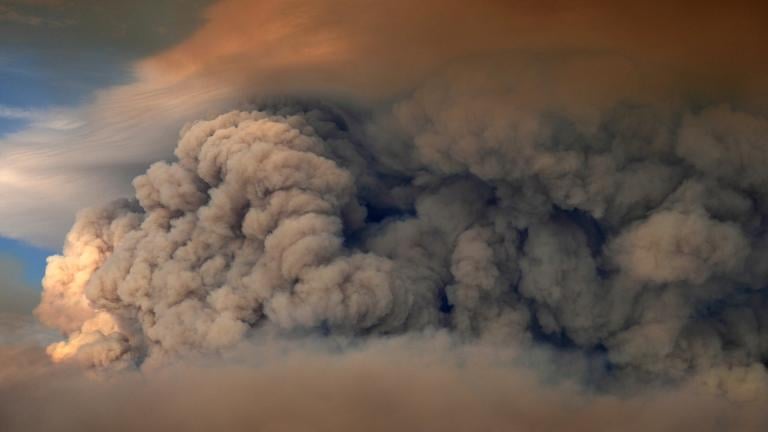 A plumes of smoke from the Camp Fire hang in the air over Moose Lake as multiple wildfires burn in Minnesota's Boundary Waters Canoe Area Wilderness, Tuesday, July 14, 2026. (Anthony Souffle / Minnesota Star Tribune via AP)