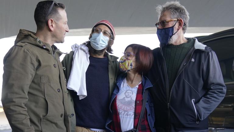 American journalist Danny Fenster, second from left, is greeted by his brother, Bryan Fenster, left, his mother, Rose Fenster, second from right, and his father, Buddy Fenster, after arriving at John F. Kennedy Airport in New York, Tuesday, Nov. 16, 2021. (AP Photo/Seth Wenig)