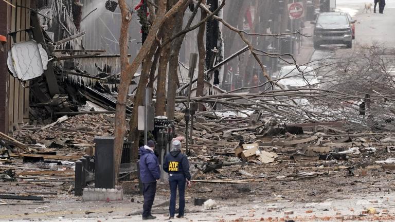 Emergency personnel work near the scene of an explosion in downtown Nashville, Tenn., Friday, Dec. 25, 2020. Buildings shook in the immediate area and beyond after a loud boom was heard early Christmas morning.(AP Photo / Mark Humphrey)