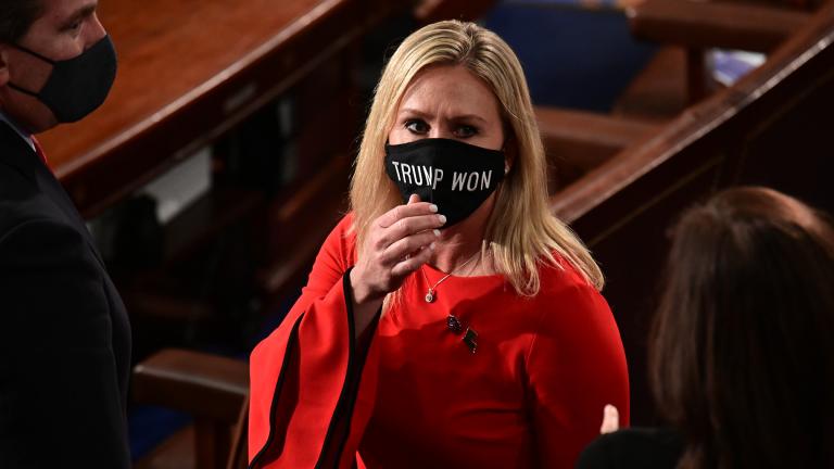 Rep. Marjorie Taylor Greene, R-Ga., wears a “Trump Won” face mask as she arrives on the floor of the House to take her oath of office on opening day of the 117th Congress at the U.S. Capitol in Washington, Sunday, Jan. 3, 2021. (Erin Scott / Pool via AP)