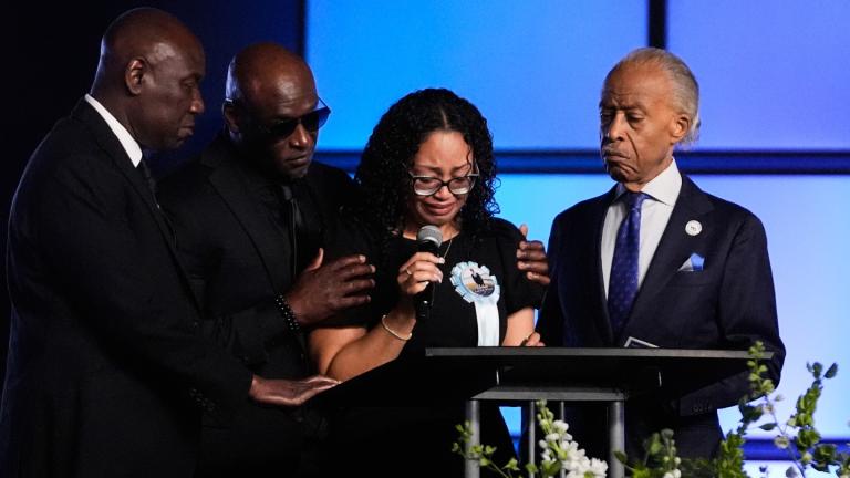 Christine Wonsley, center, is flanked by her husband Elmore, second from left, attorney Ben Crump, left, and Rev, Al Sharpton, right, during a memorial service for her son Nolan Xavier Wells, an 18-year-old found dead after taking a July 4 boat trip with friends, Monday, July 20, 2026, in Ocean Springs, Miss. (AP Photo / Gerald Herbert)