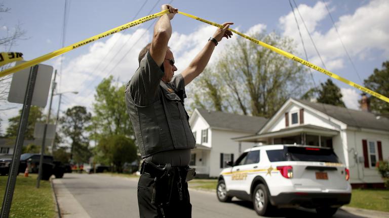 Law enforcement investigate the scene of a shooting, Wednesday, April 21, 2021 in Elizabeth City, N.C. At least one law enforcement officer with a sheriff’s department in North Carolina shot and killed a man while executing a search warrant Wednesday, the sheriff’s office said. (Stephen M. Katz / The Virginian-Pilot via AP)