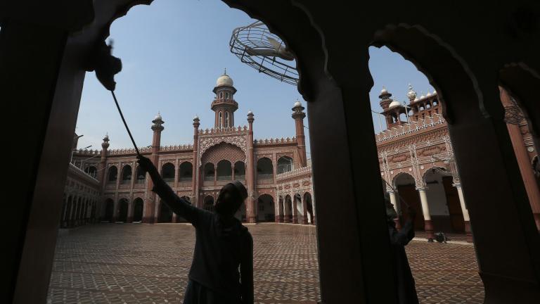 A worker cleans an area in the historical Sunehri mosque, ahead of the upcoming Muslim fasting month of Ramadan, in Peshawar, Pakistan, Wednesday, March 22, 2023. (AP Photo / Muhammad Sajjad)