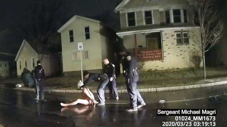 In this image taken from police body camera video provided by Roth and Roth LLP, a Rochester police officer puts a hood over the head of Daniel Prude, on March 23, 2020, in Rochester, N.Y. (Rochester Police via Roth and Roth LLP via AP)