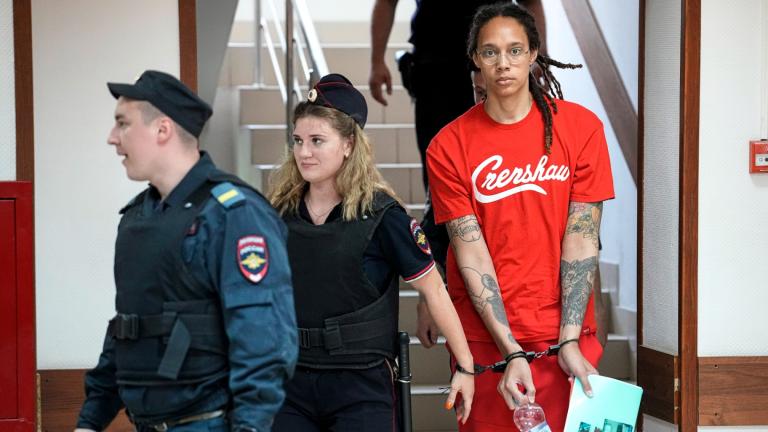WNBA star and two-time Olympic gold medalist Brittney Griner is escorted to a courtroom for a hearing, in Khimki just outside Moscow, Russia, Thursday, July 7, 2022. (AP Photo / Alexander Zemlianichenko)