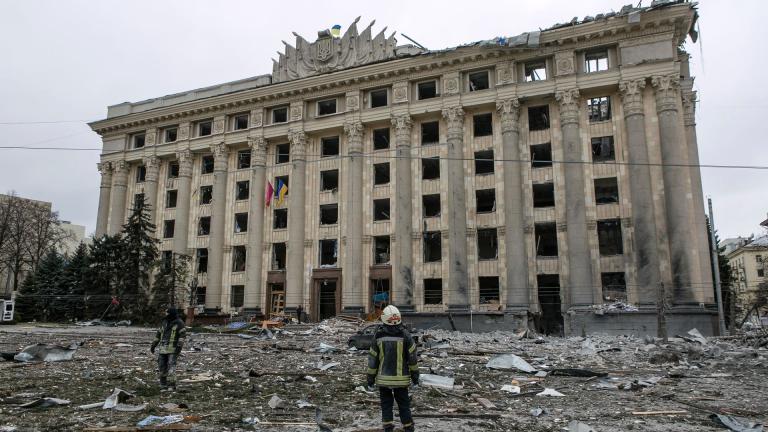 A member of the Ukrainian Emergency Service looks at the City Hall building in the central square following shelling in Kharkiv, Ukraine, Tuesday, March 1, 2022. Russian strikes pounded the central square in Ukraine’s second-largest city and other civilian sites Tuesday in what the country’s president condemned as blatant campaign of terror by Moscow. (AP Photo / Pavel Dorogoy)