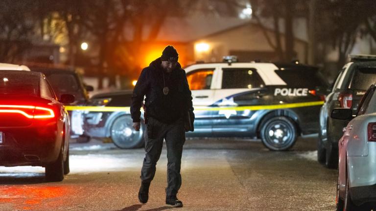 Police work a scene, Monday, Jan. 22, 2024, in Joliet, Ill., after multiple people were shot and killed over two days at three locations in the Chicago suburbs. (Tyler Pasciak LaRiviere / Chicago Sun-Times via AP)