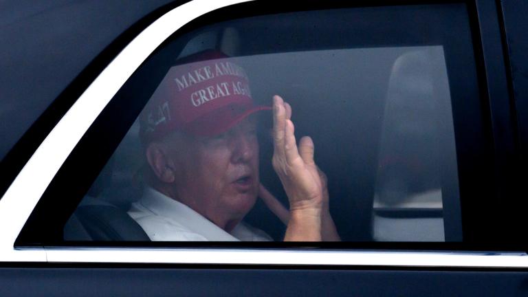 President Donald Trump waves from his vehicle as he arrives at the Trump International Golf Club, Monday, Feb. 17, 2025, in West Palm Beach, Fla. (AP Photo / Ben Curtis)