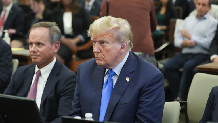 Former President Donald Trump, right, sits in the courtroom at New York Supreme Court, Monday, Oct. 2, 2023, in New York. Trump is making a rare, voluntary trip to court in New York for the start of a civil trial in a lawsuit that already has resulted in a judge ruling that he committed fraud in his business dealings. (AP Photo/Seth Wenig, Pool)