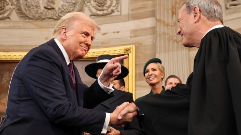 President Donald Trump gestures to Supreme Court Chief Justice John Roberts after being sworn in as president during the 60th Presidential Inauguration in the Rotunda of the U.S. Capitol in Washington, Monday, Jan. 20, 2025. (Chip Somodevilla / Pool Photo via AP)