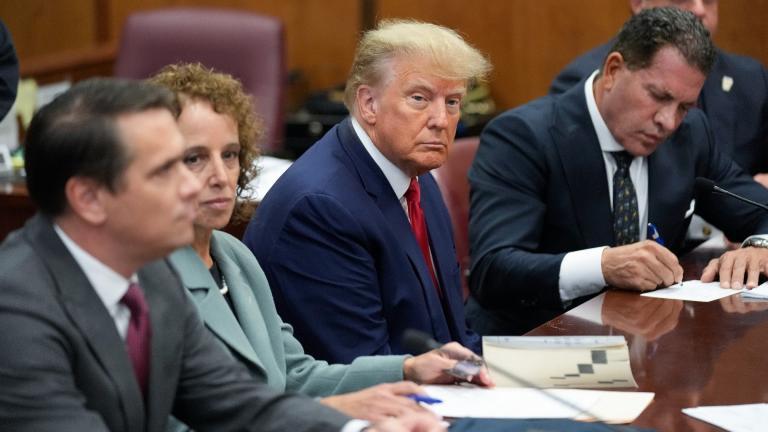 Former President Donald Trump sits at the defense table with his legal team in a Manhattan court, Tuesday, April 4, 2023, in New York. Trump is appearing in court on charges related to falsifying business records in a hush money investigation, the first president ever to be charged with a crime. (AP Photo / Seth Wenig, Pool)