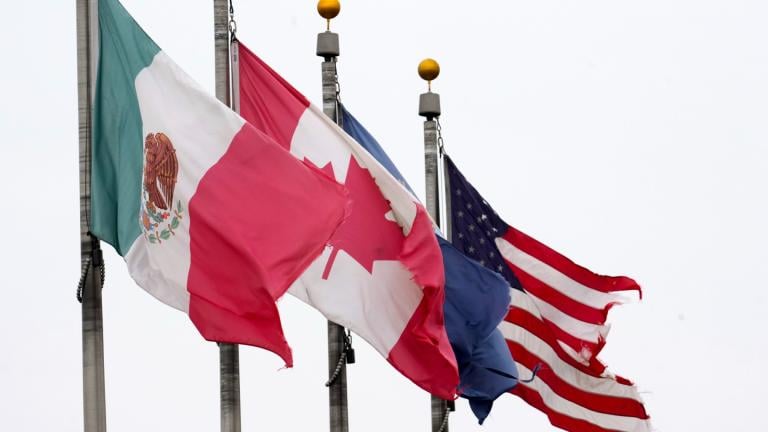 The flags of Mexico, Canada and the United States are shown near the Ambassador Bridge, Monday, Feb. 3, 2025, in Detroit. (AP Photo / Paul Sancya)