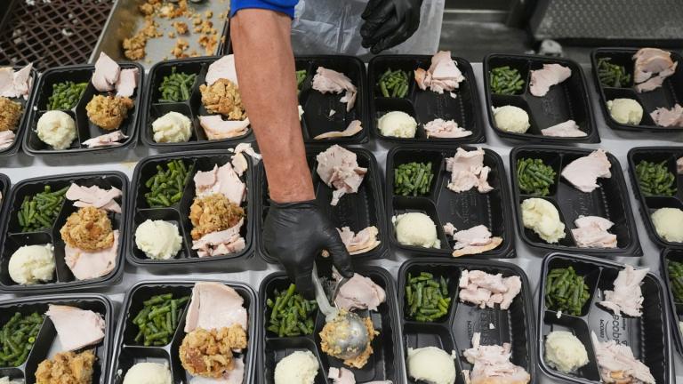 A volunteer prepares meals at the Philabundance Community Kitchen in Philadelphia, Thursday, Oct. 30, 2025. (AP Photo / Matt Rourke)