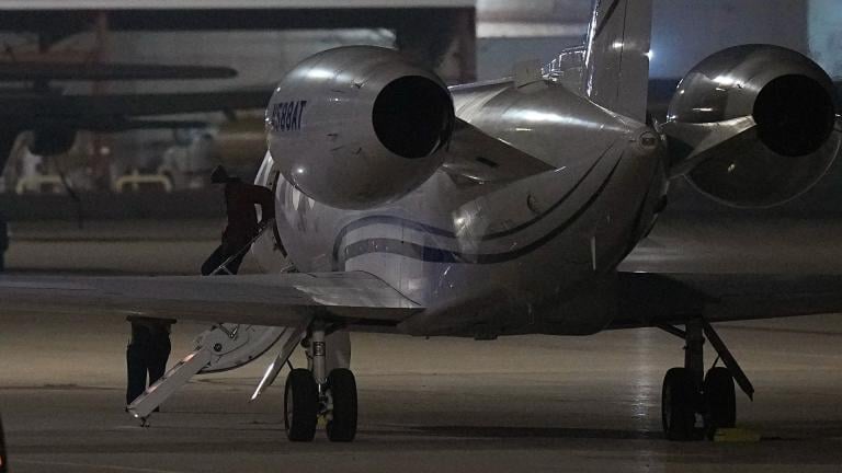 WNBA star Brittney Griner deplanes at Kelly Field in San Antonio, Texas, following her release in a prisoner swap with Russia, Friday, Dec. 9, 2022. (AP Photo/Eric Gay)