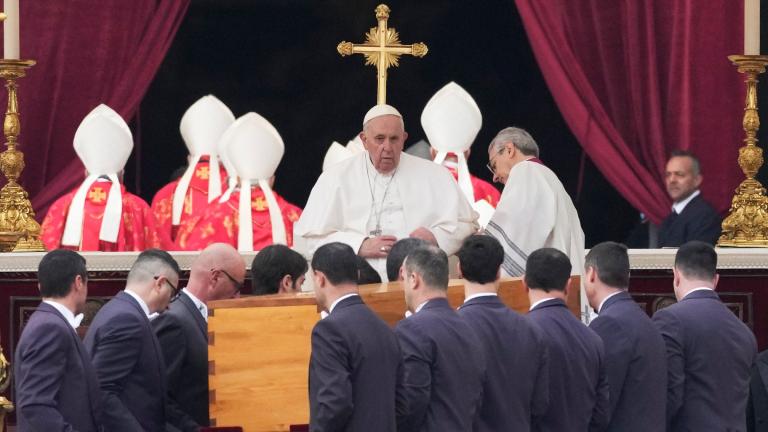 Pope Francis, center, sits as the coffin of late Pope Emeritus Benedict XVI St. Peter's Square is carrying for a funeral mass at the Vatican, Thursday, Jan. 5, 2023. (AP Photo / Alessandra Tarantino)