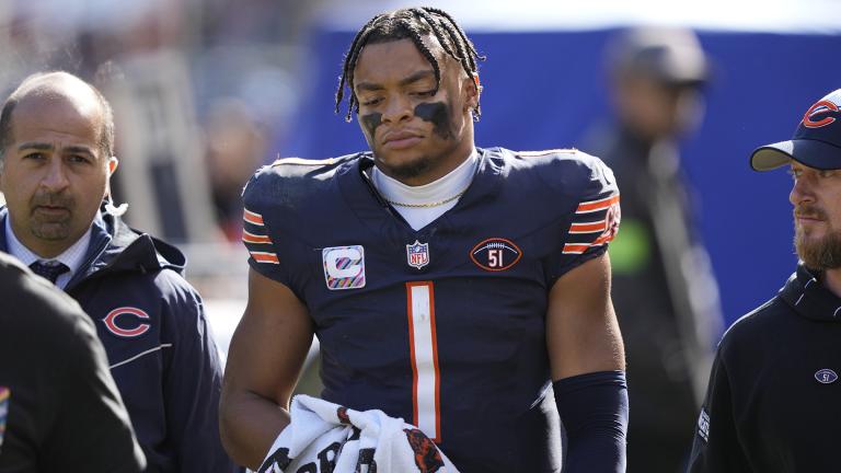 Chicago Bears quarterback Justin Fields walks to the locker room after being sacked during the second half of an NFL football game against the Minnesota Vikings, Sunday, Oct. 15, 2023, in Chicago. (AP Photo / Charles Rex Arbogast)