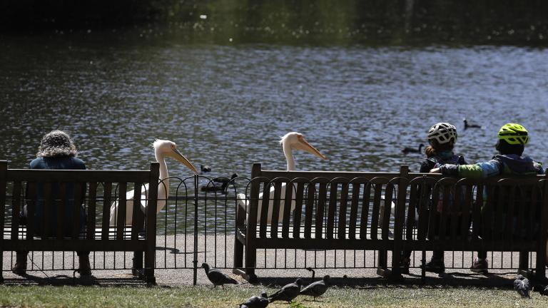 People sit on benches obeying the social distancing in St James’s Park in London, as the country continues in lockdown to help curb the spread of the coronavirus, Sunday, April 19, 2020. (AP Photo / Kirsty Wigglesworth)