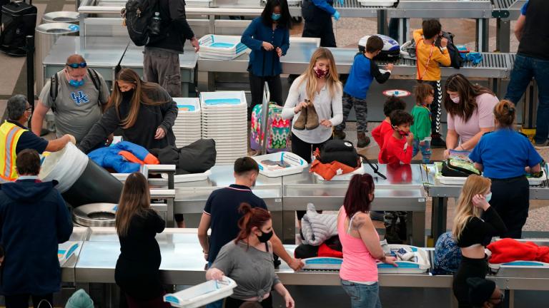 Travelers wear face masks while passing through the south security checkpoint in the main terminal of Denver International Airport Tuesday, Dec. 22, 2020, in Denver. (AP Photo / David Zalubowski) Travelers wear face masks while passing through the south security checkpoint in the main terminal of Denver International Airport Tuesday, Dec. 22, 2020, in Denver. (AP Photo / David Zalubowski)