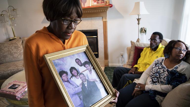Glenda O'Neal, mother of Dr. Tamara O'Neal, shows a photo of her family at their home in LaPorte, Ind., Tuesday, Nov. 20, 2018. Dr. O’Neal was one of the three people fatally shot Monday at Mercy Hospital. (Zbigniew Bzdak / Chicago Tribune via AP)