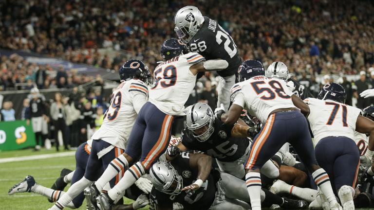 Oakland Raiders running back Josh Jacobs (28) goes in for a touchdown during the second half of an NFL football game against the Chicago Bears at Tottenham Hotspur Stadium, Sunday, Oct. 6, 2019, in London. (AP Photo / Tim Ireland)