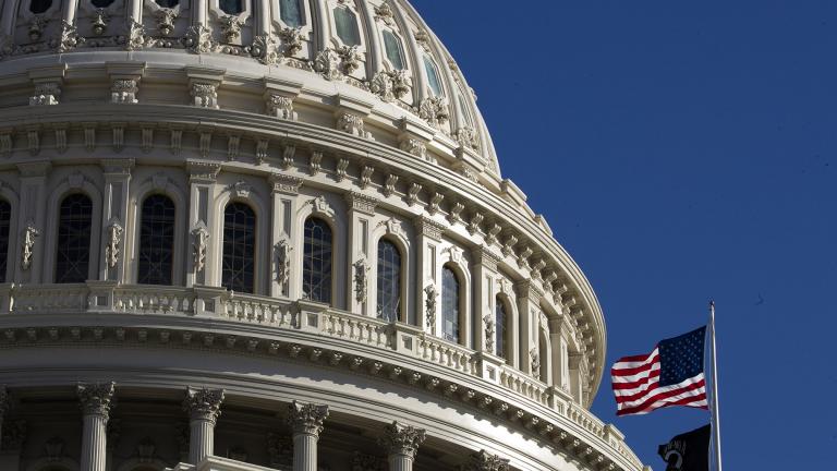 The U.S. flag flies over the U.S. Capitol in Washington on Sunday, Jan. 19, 2020. (AP Photo / Manuel Balce Ceneta)