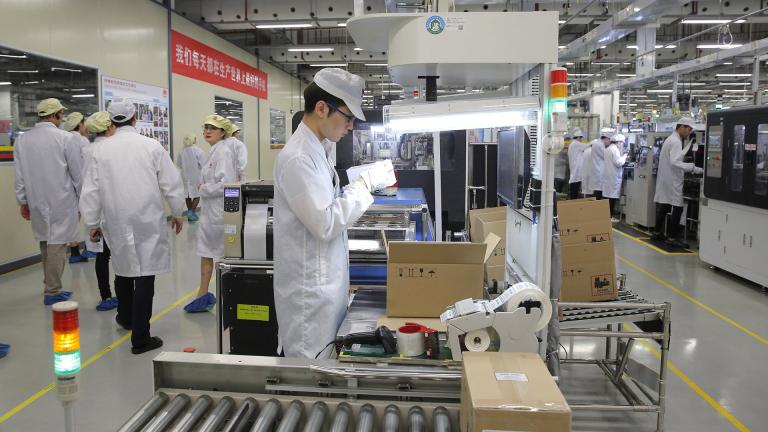   In this March 6, 2019, file photo a staff member works on a mobile phone production line during a media tour in Huawei factory in Dongguan, China’s Guangdong province. Huawei Technologies Co. is one of the world’s biggest supplier of telecommunications equipment. (AP Photo / Kin Cheung, File)